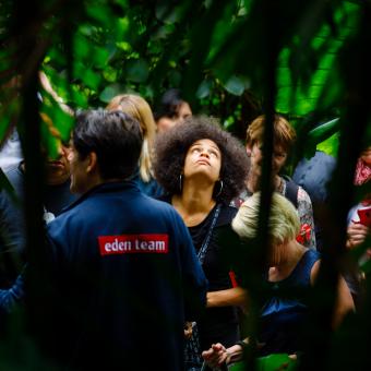 Women looking up whilst on a group tour of the Rainforest Biome
